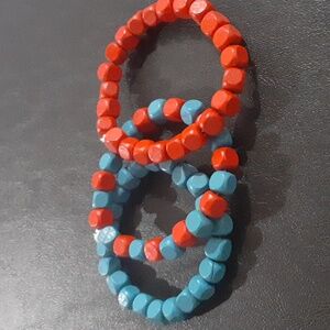 🌹 Red and blue wooden bracelets.